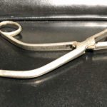 A type of steel medical implement with bent handles