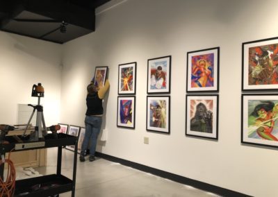 Installing works of art by Alex Ross in the Sheboygan County Museum