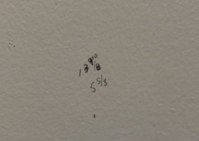 Marks on a wall - figuring where to put the nail.