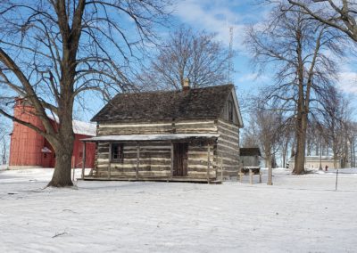 LogSheboygan County Museum'sCabin and Barn in Winter