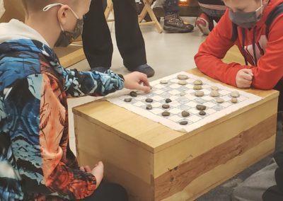 Students play a round of checkers